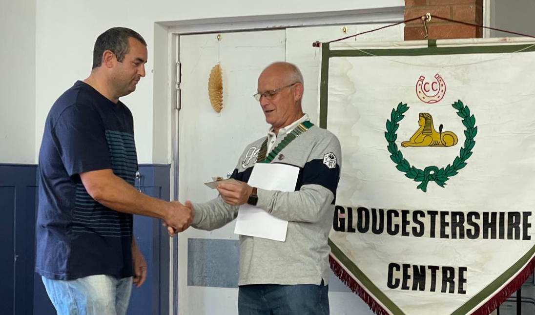 Phil Harris (left) handing over to Martin Reeves (right) at the 2025 AGM